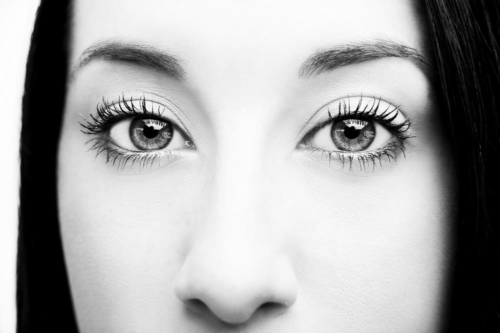 Close up black and white photo of woman's eyes